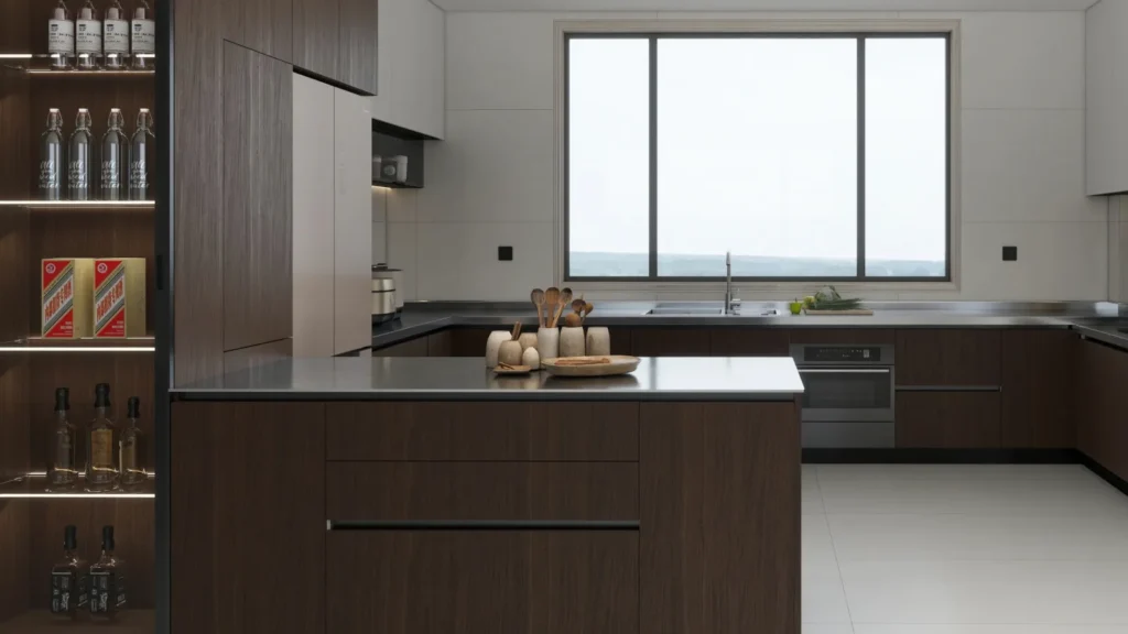 Island view into U-shaped kitchen—charcoal base cabinets, large window, built-in oven and long worktop